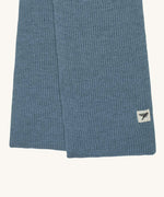 A close up of the logo label on the Silverstick Cirrus Merino Wool Scarf in a Celeste blue colour. Silverstick are proudly made in the UK and stocked here at Babipur. 