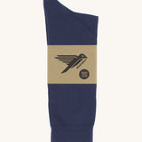 A pair of navy blue GOTS-Certified organic cotton everyday socks by Silverstick in recyclable paper packaging, made in Britain.
