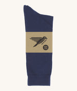 A pair of navy blue GOTS-Certified organic cotton everyday socks by Silverstick in recyclable paper packaging, made in Britain.
