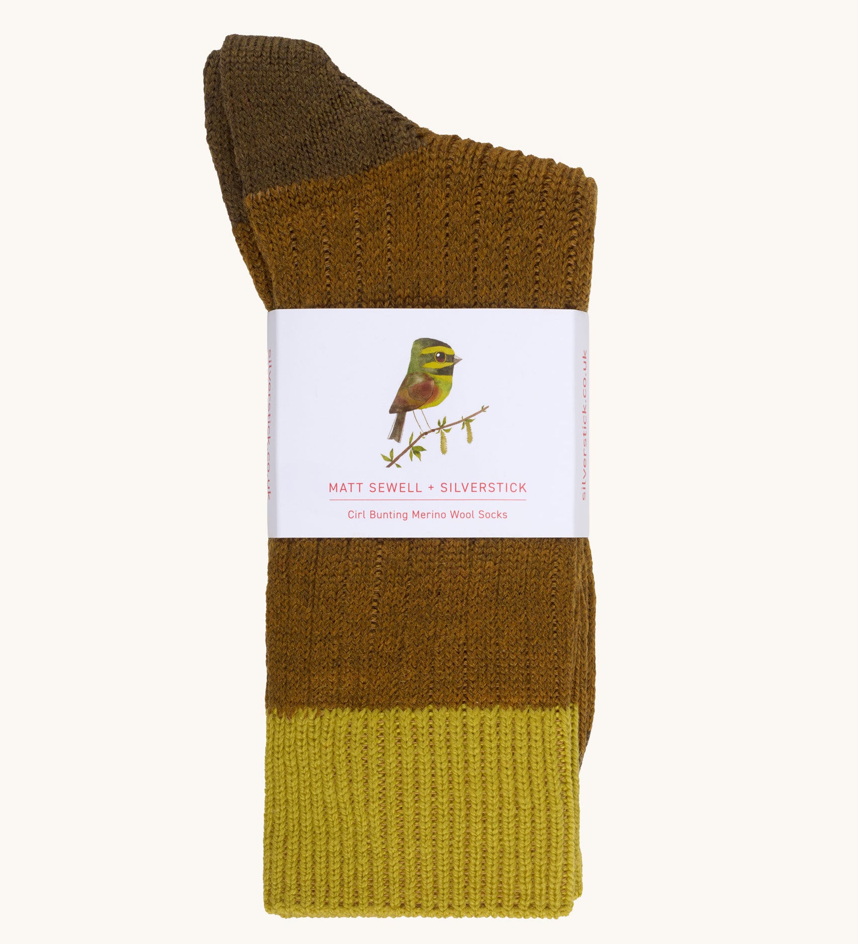 Silverstick Matt Sewell Cirl Bunting Merino Socks shown folded over and placed into their paper packaging sleeve.