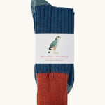 Silverstick Matt Sewell Merlin Merino Socks shown folded over and placed in their paper packaging sleeve. 