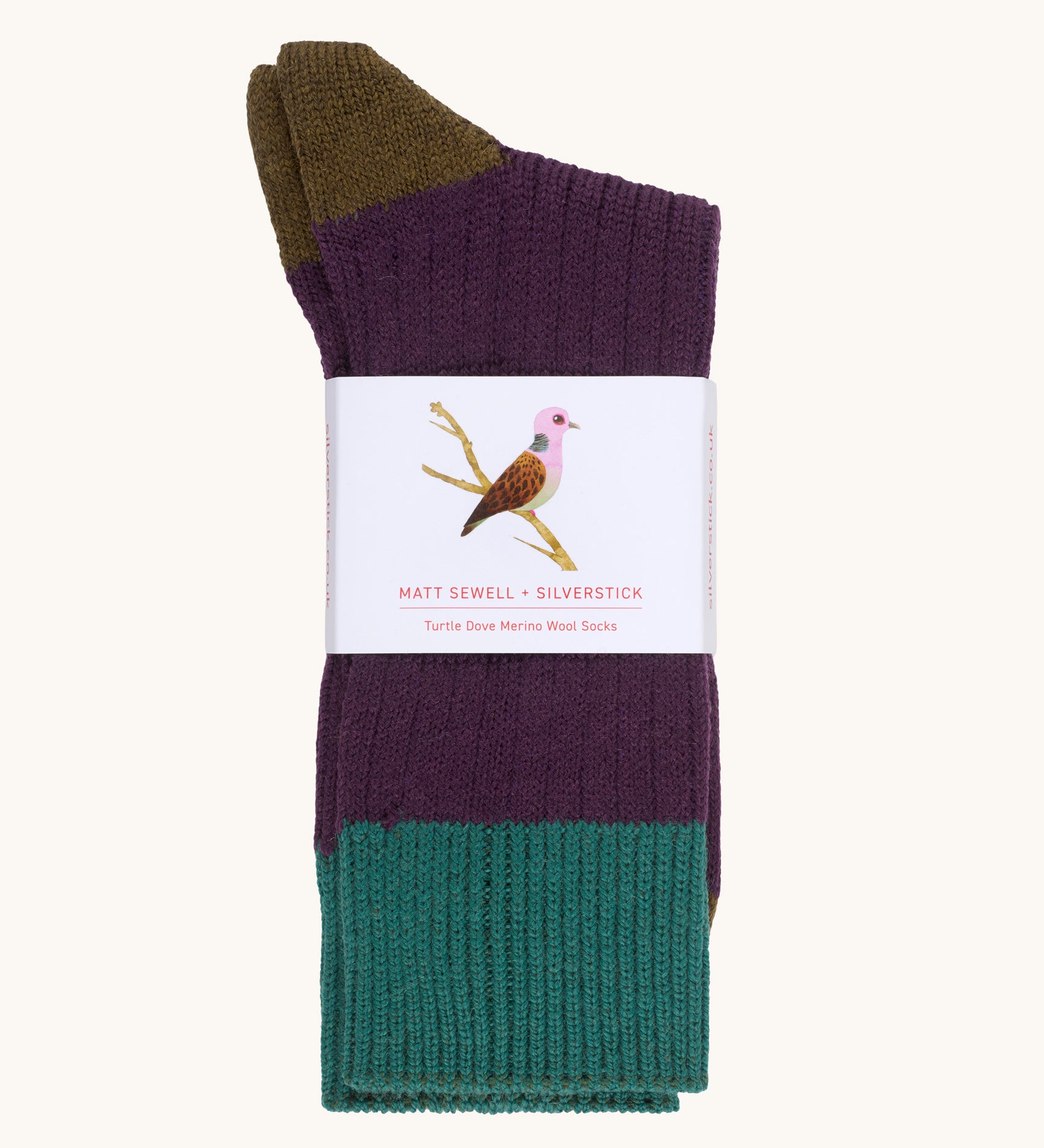 Silverstick Matt Sewell Turtle Dove Merino Wool Socks shown folded over and placed into a paper packaging sleeve. 