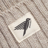 A close up of the label on the Silverstick Moffat Merino Wool Beanie in the Oat colourway. Silverstick are proudly made in the UK and available at Babipur. 