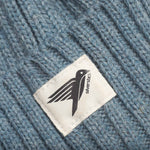 A closeup of the Silverstick cotton logo, stitched onto the Merino Wool winter beanie hat, made in Britain. 