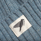 A closeup of the Silverstick cotton logo, stitched onto the Merino Wool winter beanie hat, made in Britain. 