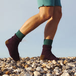 A closeup of a man wearing the Silverstick x Matt Sewell merino wool socks in the turtle dove purple colour
