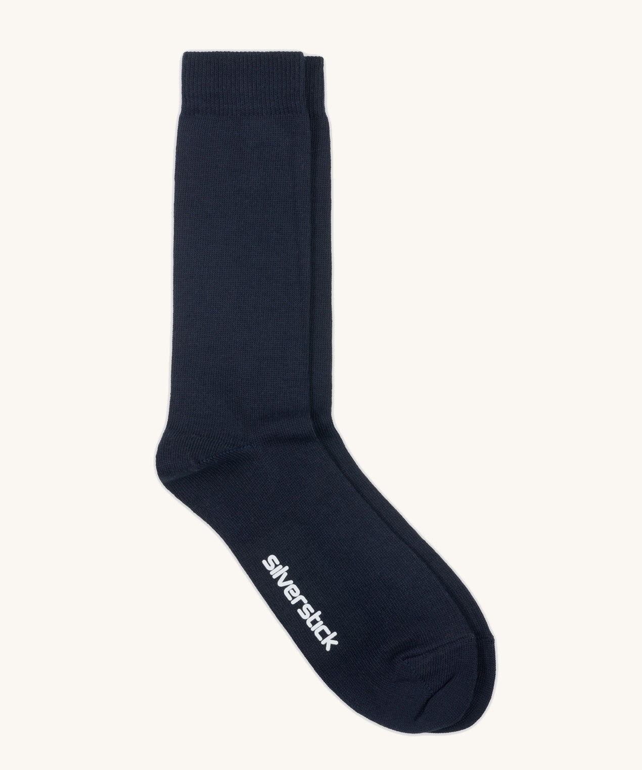 GOTS-Certified organic cotton socks by Silverstick in black with branding on the sole, made in Britain. 