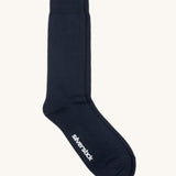 GOTS-Certified organic cotton socks by Silverstick in black with branding on the sole, made in Britain. 