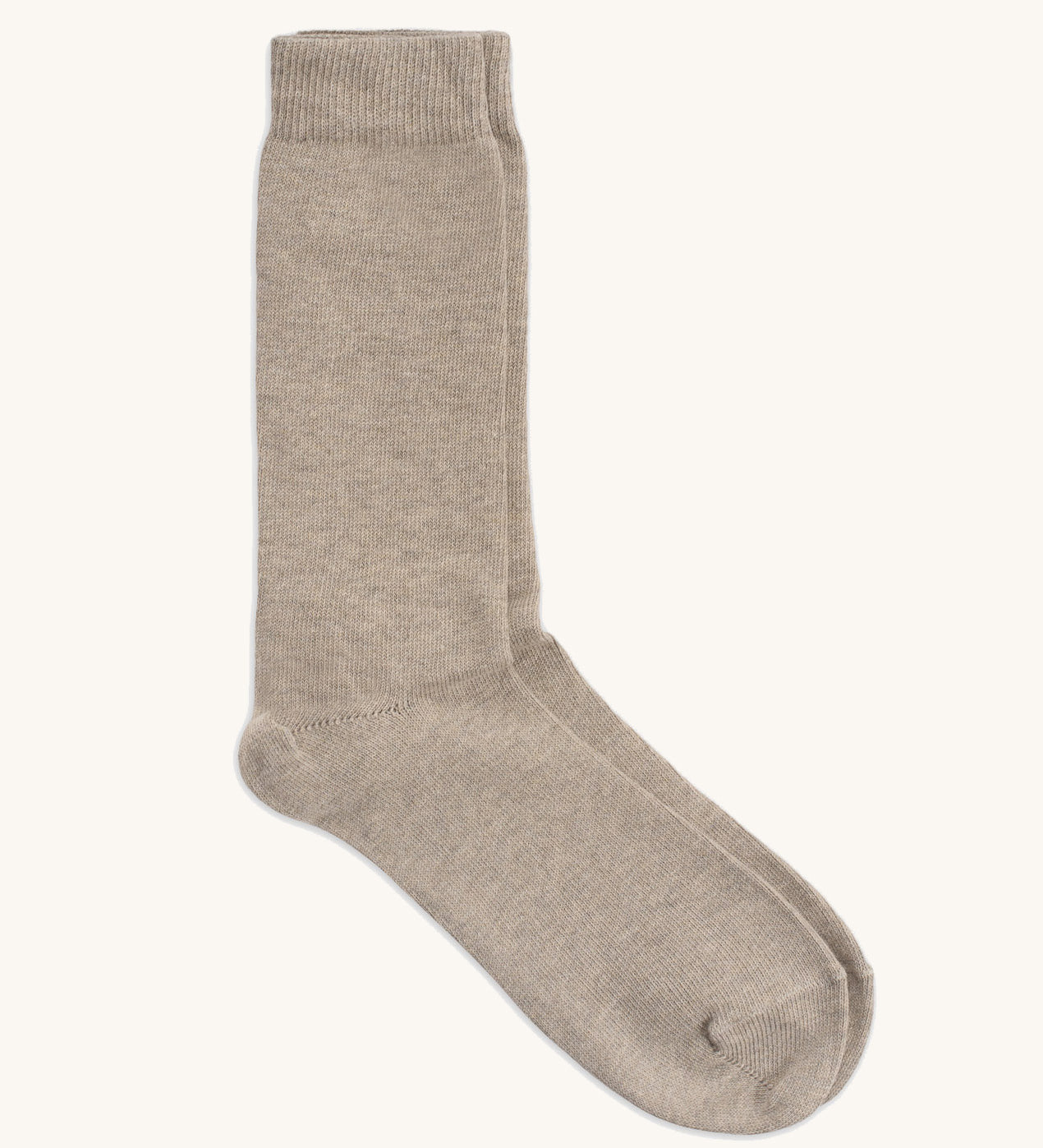 A pair of GOTS organic cotton socks made in Britain by Silverstick, in a creamy oat solid colour. 