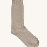 A pair of GOTS organic cotton socks made in Britain by Silverstick, in a creamy oat solid colour. 