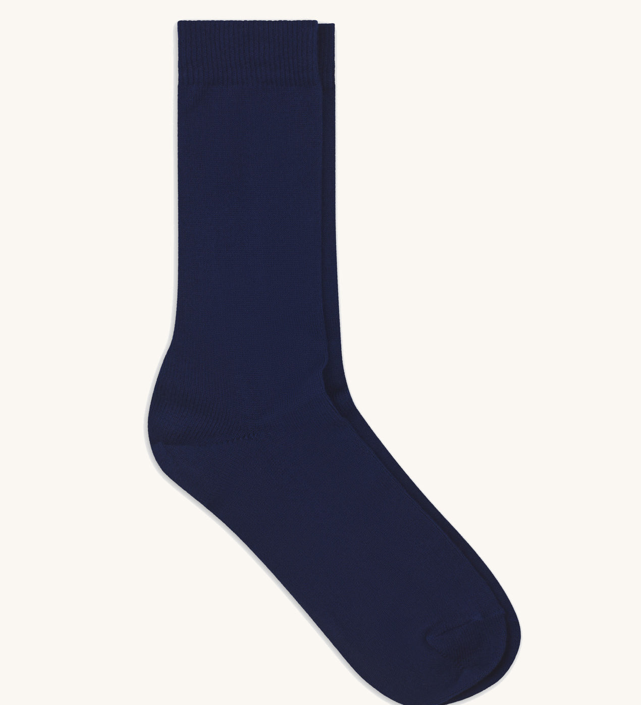 A pair of solid navy blue socks by Silverstick, made from GOTS Certified organic cotton grown in India and knitted in the UK. 