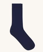A pair of solid navy blue socks by Silverstick, made from GOTS Certified organic cotton grown in India and knitted in the UK. 