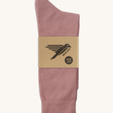 A pair of pink GOTS-Certified organic cotton everyday socks by Silverstick in recyclable paper packaging, made in Britain.