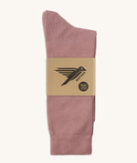 A pair of pink GOTS-Certified organic cotton everyday socks by Silverstick in recyclable paper packaging, made in Britain.