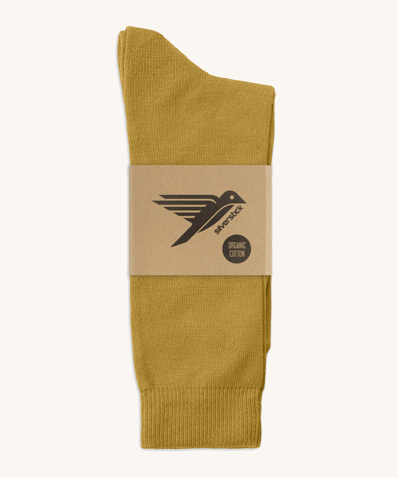 A pair of mustard yellow GOTS-Certified organic cotton everyday socks by Silverstick in recyclable paper packaging, made in Britain.