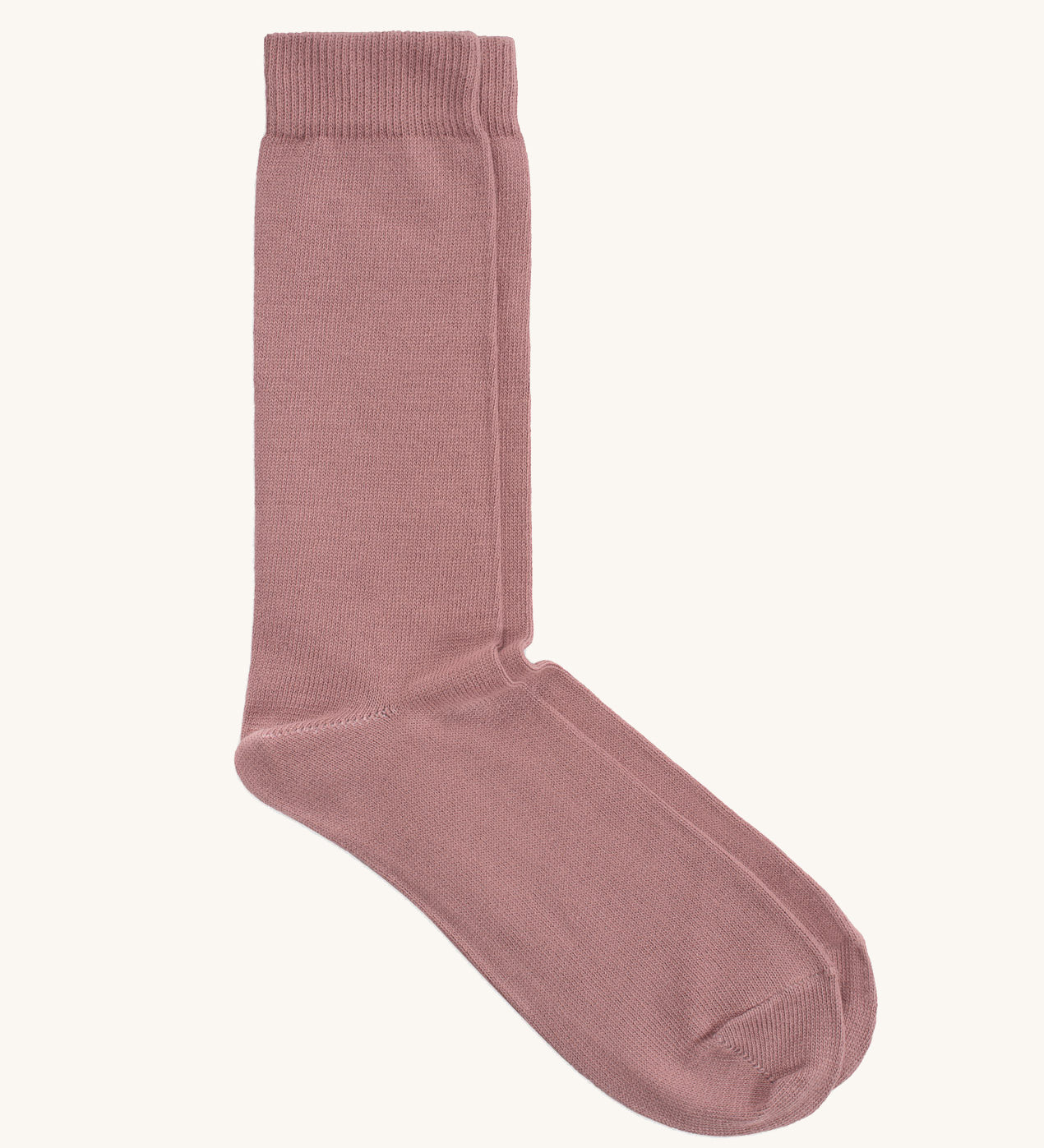 A pair of solid pink socks by Silverstick, made from GOTS Certified organic cotton grown in India and knitted in the UK. 