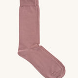 A pair of solid pink socks by Silverstick, made from GOTS Certified organic cotton grown in India and knitted in the UK. 