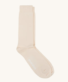 A pair of solid white socks by Silverstick, made from GOTS Certified organic cotton grown in India and knitted in the UK. 