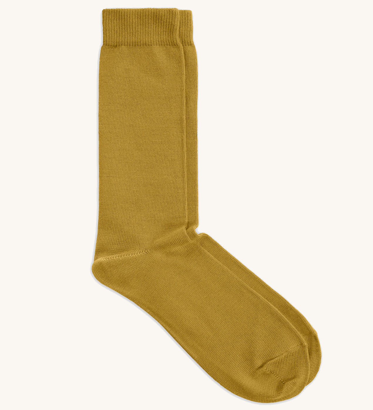 A pair of solid yellow socks by Silverstick, made from GOTS Certified organic cotton grown in India and knitted in the UK. 