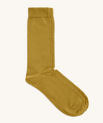 A pair of solid yellow socks by Silverstick, made from GOTS Certified organic cotton grown in India and knitted in the UK. 