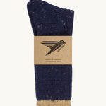 Silverstick Pennine Wool Socks in Navy. The socks are shown folded over and placed in the cardboard packaging slip. 