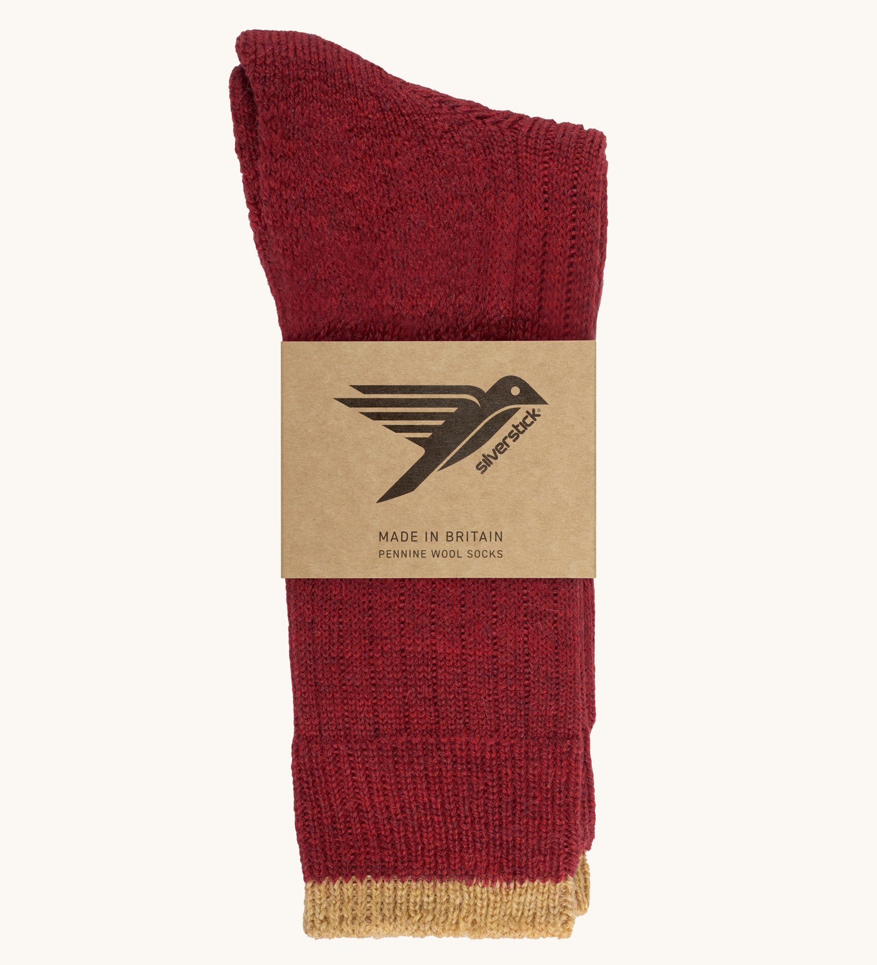 The Silverstick Pennine Wool Socks in Red shown folded over and placed in their cardboard packaging sleeve. 