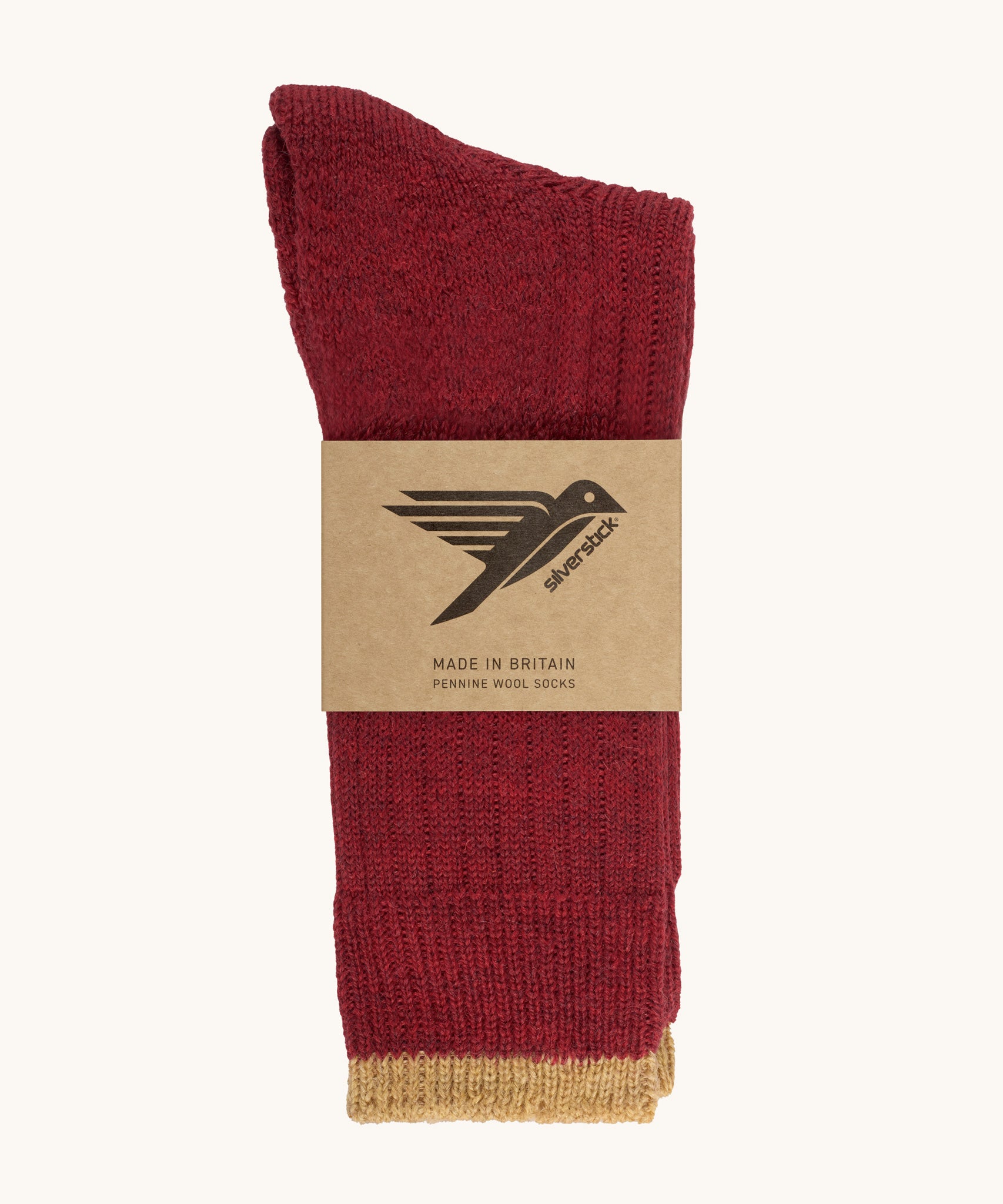 The Silverstick Pennine Wool Socks in Red shown folded over and placed in their cardboard packaging sleeve. 