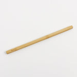 singular bambu straw pictured on a plain background