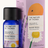 Sleep Well pure essential oil blend in a blue glass bottle in front of a decorative pink cardboard box.