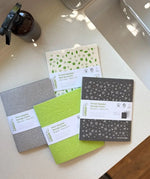 A Slice of Green Swedish sponge cloths in different colours, made from natural materials and recycled cotton, used in an eco-friendly kitchen.