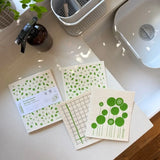 Three A Slice of Green Mint Leaf Swedish sponge cloths made from natural materials and recycled cotton, with coordinating green botanical and checked prints.