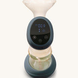 The digital smart touch screen on the Lola&Lykke Smart Electric Breast Pump. The image shows the on and off button, and suction control on the display