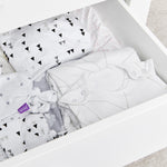 A close up of the contents of a drawer from the SnuzKot changing unit drawer