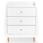 A snuzkot natural baby changing unit pictured on a plain background