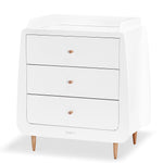 A side angled view of the Natural SnuzKot changing unit pictured on a plain background 