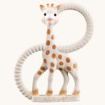 Sophie The Giraffe So Pure Very Soft Teething Ring. A Sophie The Giraffe Teether with two textured rings to sooth hurting gums, on a cream background