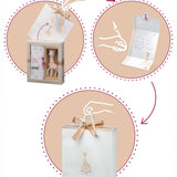 A diagram showing what to do with The Sophie the Giraffe premium baby gift set; take the gift bag out, write your personal message, and gift!