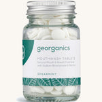 A Jar of the spearmint Georganics mouthwash tablets on a cream background
