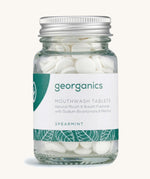 A Jar of the spearmint Georganics mouthwash tablets on a cream background