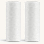 A pair of spearmint Georganics floss refills 