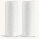 A pair of spearmint Georganics floss refills 
