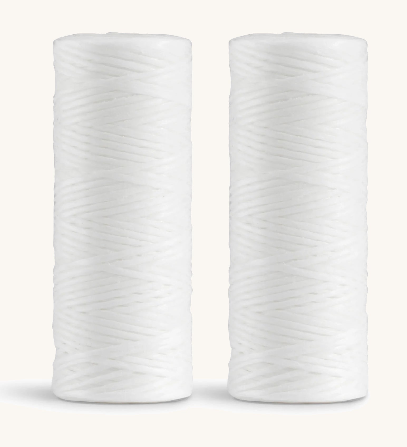 A pair of spearmint Georganics floss refills 