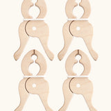 Set of 4 Speelbelovend giant wooden pegs that can be used to clamp cloths on Triclimbs and Trigonos dens