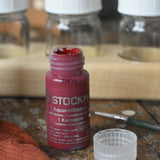 Stockmar 20ml concentrated watercolour paint in carmine red with the lid taken off. 