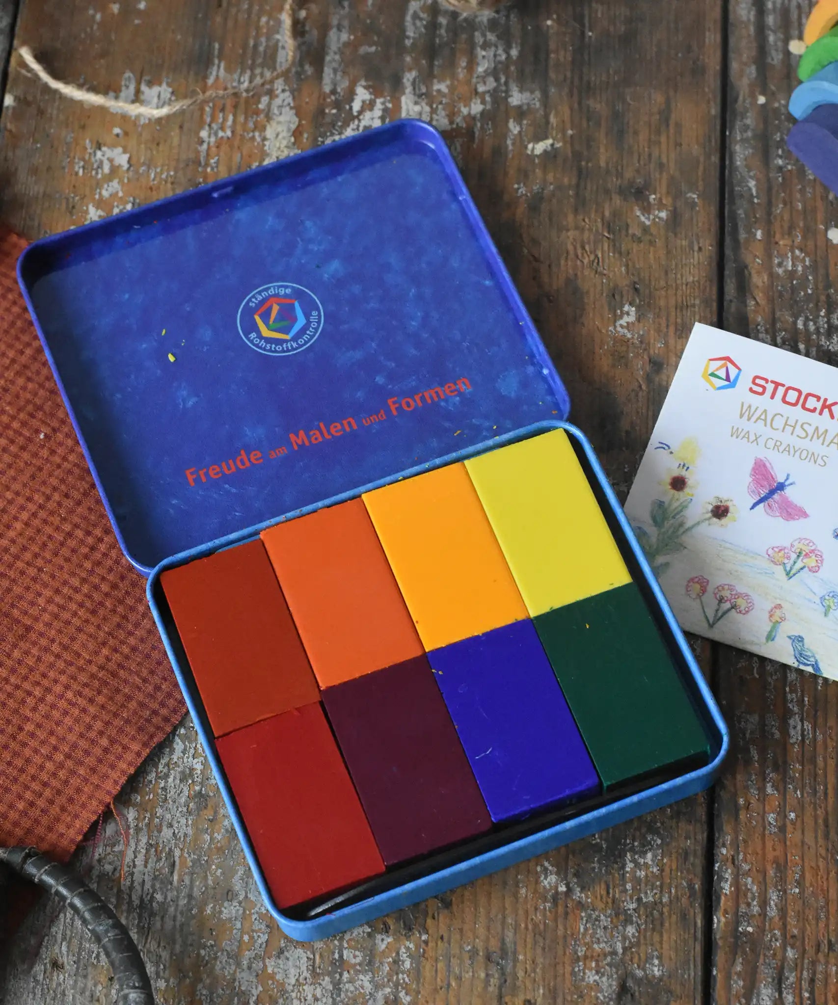 Stockmar wax blocks in 8 Waldorf colours in a storage tin.