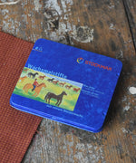 Stockmar 8  colour assortment wax crayons in a blue metal storage tin. 