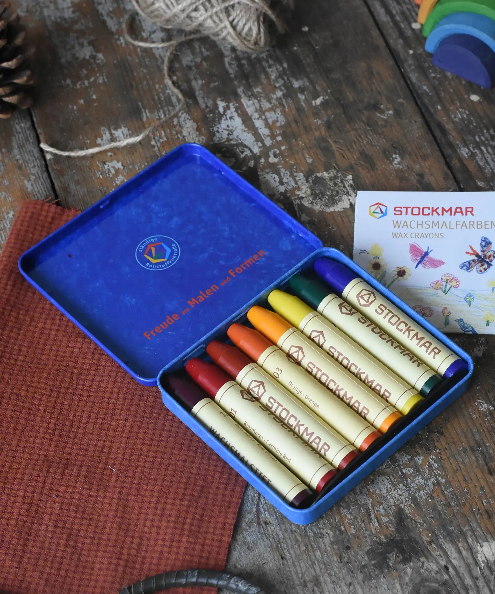 Stockmar 8 Wax Crayons in Waldorf colours in a metal storage tin.