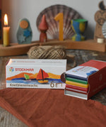 Stockmar modelling beeswax in a pack of 6 Sheets. White, brown, red, yellow green and blue sheets.