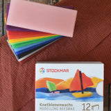 Stockmar Modelling Beeswax Clay 12 Colour Sheets. Wax sheets shown out of the cardboard packaging.