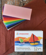 Stockmar Modelling Beeswax Clay 12 Colour Sheets. Wax sheets shown out of the cardboard packaging.